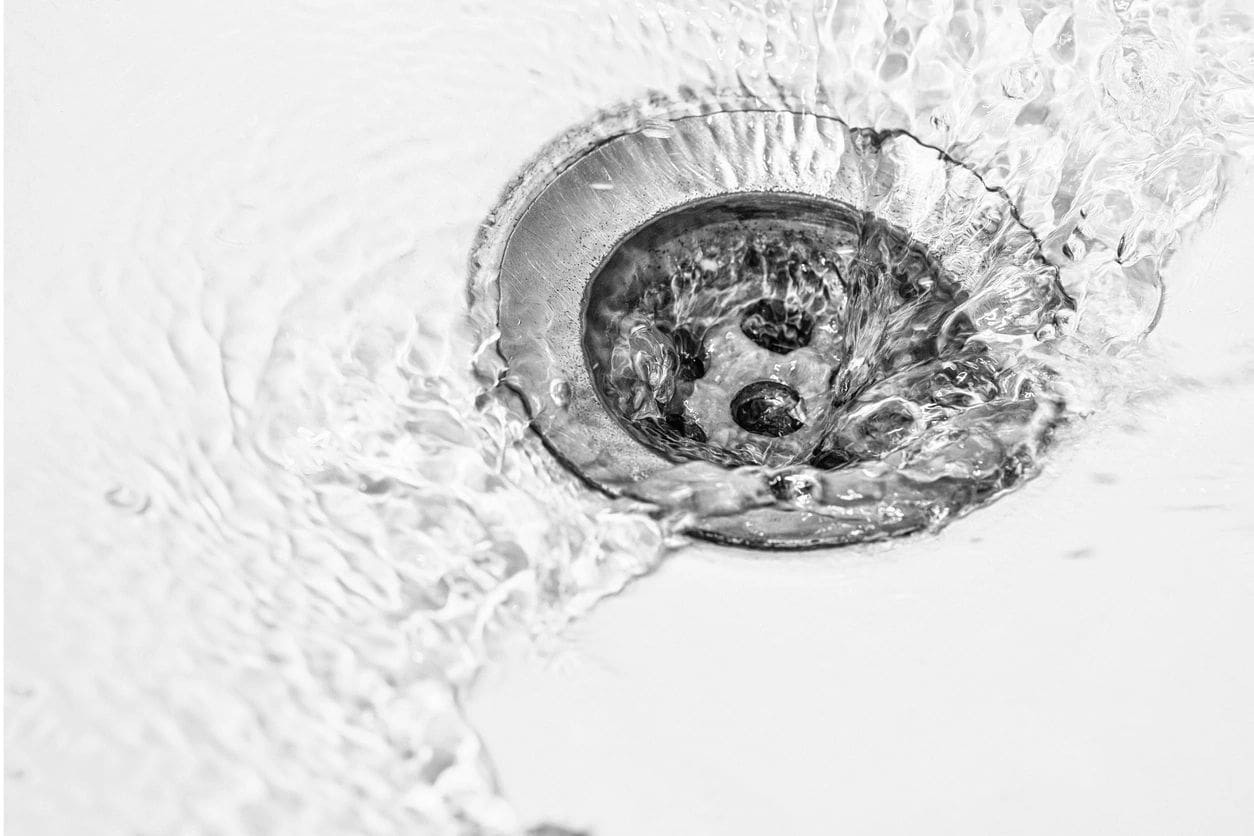 A sink with water running in it.