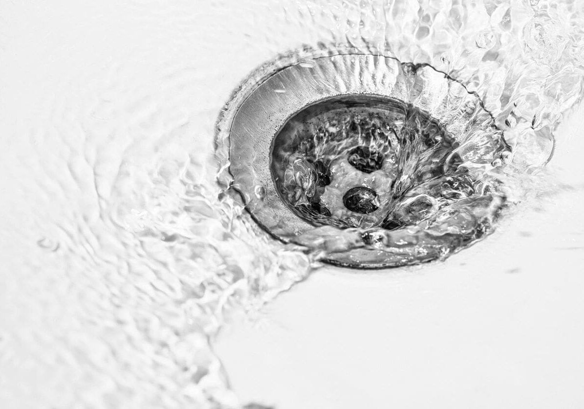 A sink with water running in it.